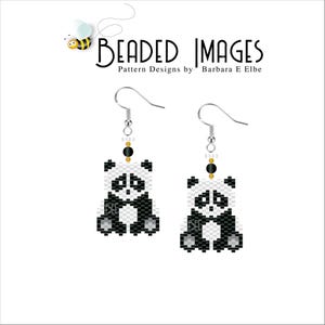 May include: A pair of beaded earrings featuring a black and white panda design. The earrings are silver and have a dangling design.