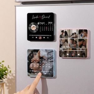 May include: Three square refrigerator magnets featuring custom photo collages and calendar designs. One black magnet displays a vinyl record graphic with the text Linda and David August 2026. Another magnet shows a photo grid labeled Love Story.