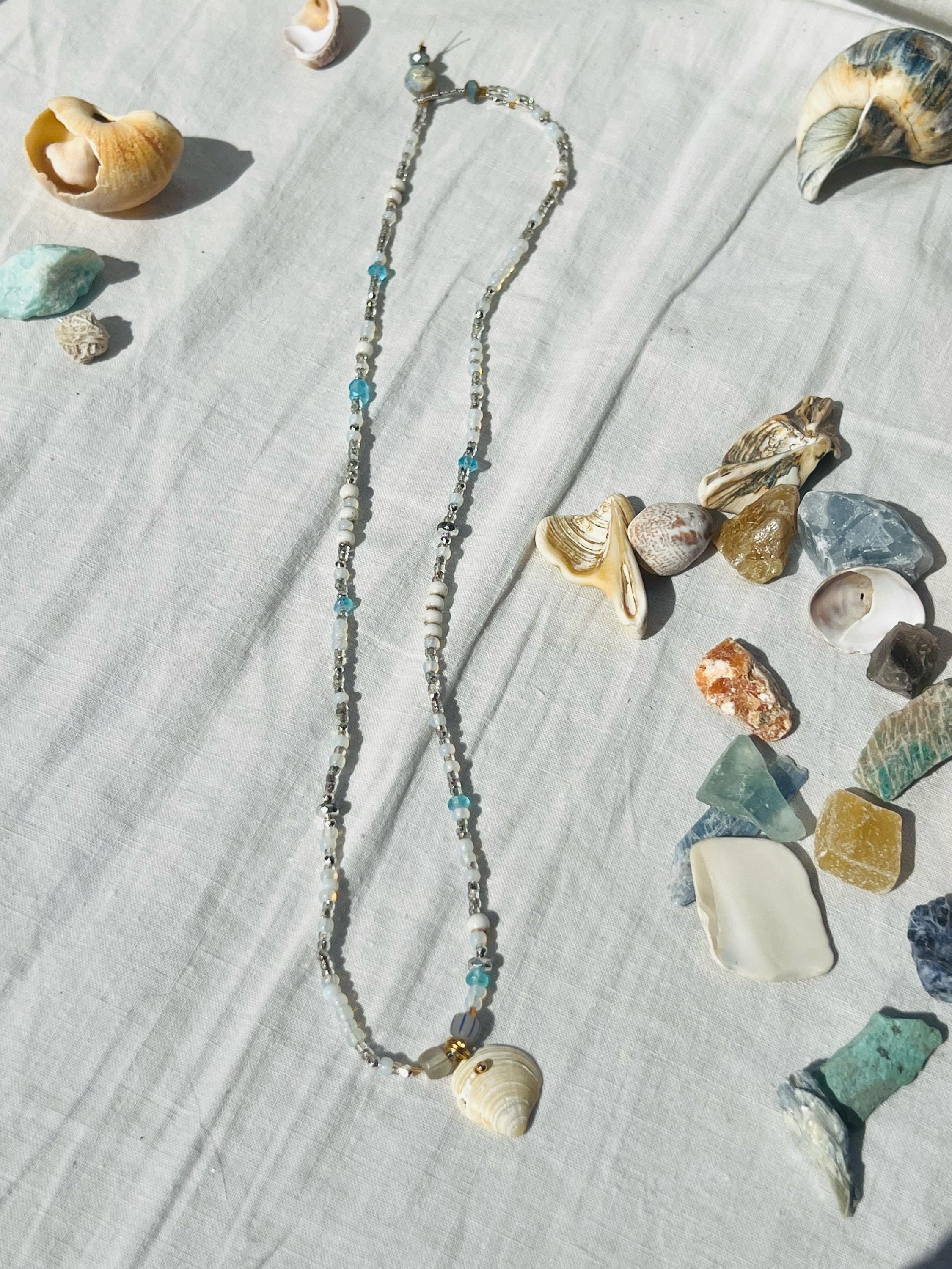 Beach Mist Hand Beaded Necklace, a unique piece featuring a mix of vintage beads and a Montauk shell