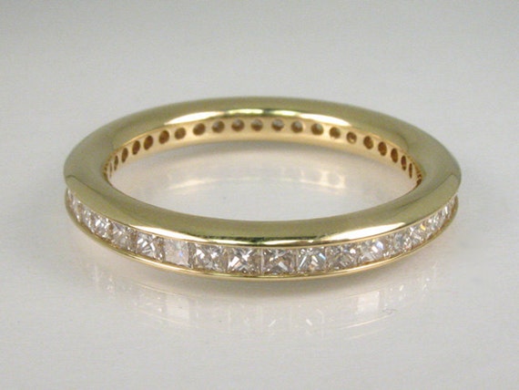 Vintage Diamond Eternity Ring Featuring 42 Princess Cut Diamonds 0.84 Carats in 18K Yellow Gold GIA Graduate Appraisal Included USD 3535.00