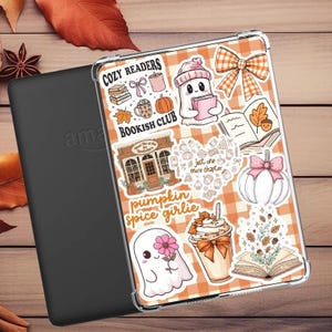 May include: A clear tablet case featuring a variety of autumn-themed stickers including ghosts, a bookstore, a pumpkin spice drink, books, and orange plaid patterns. The stickers display text such as COZY READERS BOOKISH CLUB, just one more chapter, and pumpkin spice girlie.