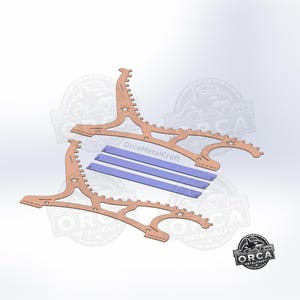 May include: Two laser-cut wooden display stands with a unique, curved design, featuring star-shaped cutouts. Three blue rectangular pieces are included. The Orca MetalCraft logo is visible in the bottom right corner.