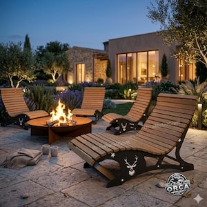 May include: Outdoor patio set featuring four wooden chaise lounges with black metal deer silhouettes and a round fire pit with a burning fire. The set is arranged on a stone patio with a house in the background.