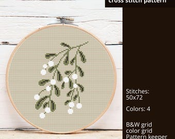May include: A cross stitch pattern of a branch of mistletoe with white berries and green leaves. The pattern is 50 stitches wide by 72 stitches tall and uses 4 colors. The pattern includes a black and white grid, a color grid, and a pattern keeper. A list of DMC colors is also included.