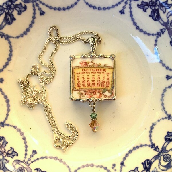Broken china jewelry pendant necklace October birthday 1921 calendar plate with Swarovski crystal drop
