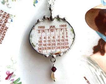 Antique January 1909 calendar plate pendant, broken china jewelry necklace, January birthday, garnet crystal, Dishfunctional Designs