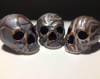 Metallic Iron Skulls With Shino Overglaze
