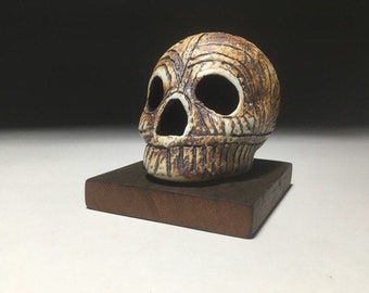 Texted Division Carved Skull