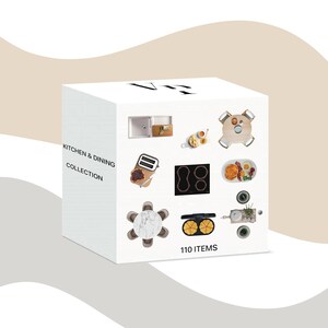May include: A white cube featuring the text "KITCHEN & DINING COLLECTION" and "110 ITEMS". The cube showcases kitchen and dining items such as a sink, toaster, hob, table, and food, presented as a collection.