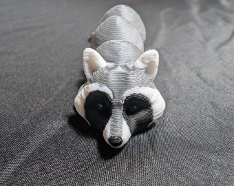 Little Raccoon fully articulated flexi keychain. known as trash pandas ready to explore the garbage cans Check out our whole line of Littles