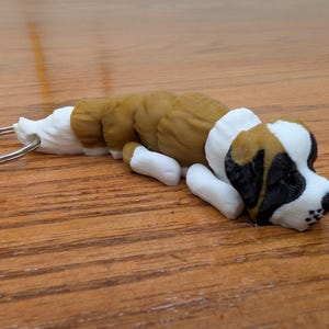 Big little Saint Bernard fully articulated flexi keychain. Explore our whole line of Littles