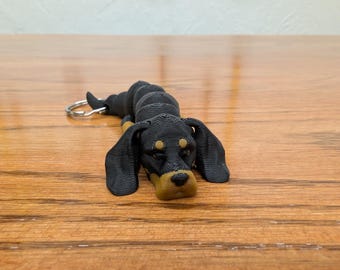 Coonhound dog fully articulated flexi keychain. Explore our whole line of Littles