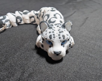 Snow Leopard big cat fully articulated flexi keychain. Ready to explore the Mountains hunt and explore. Explore our whole line of Littles