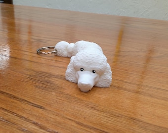 White Poodle fully articulated flexi keychain. Explore our whole line of Littles