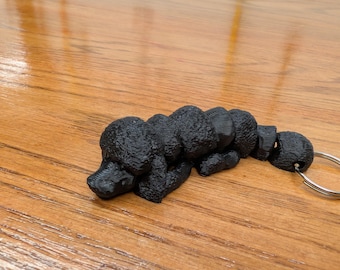 Black Poodle fully articulated flexi keychain. Explore our whole line of Littles
