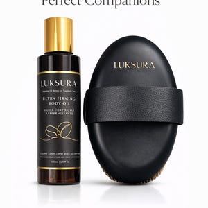 May include: A black bottle of Ultra Firming Body Oil with a gold cap and a black exfoliating dry brush. The bottle is labeled "LUKSURA" and contains 3.4 fl oz. The brush has a black strap and bristles.