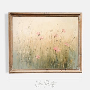 May include: A framed painting depicting a field of wildflowers with pink blossoms. The painting has a vintage aesthetic and is framed in a light wood frame.
