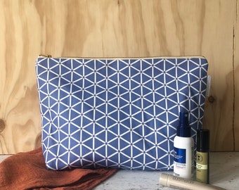 Karin Toiletry Bag, striking blue design cosmetic bag, large zip pouch, waterproof lining and a chunky metal zip, Made in the UK
