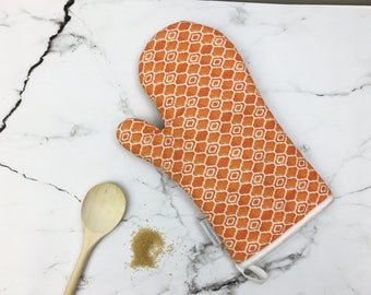 Orange Oven Glove, Geometric oven mitt, Alta design, striking pattern, kitchenware, home ware, vibrant orange pot holder, contemporary style