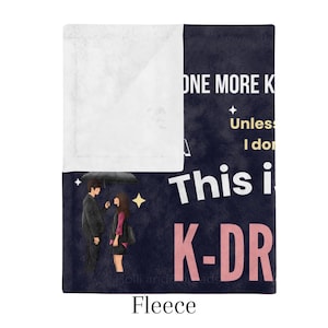 Close-up of a cozy K-Drama Watching Blanket, featuring a romantic couple under an umbrella and playful quotes, perfect for K-drama fans.