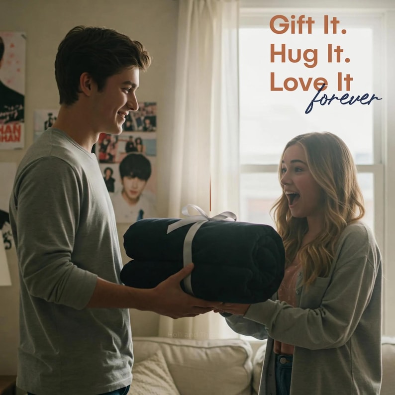 May include: A person gives a gift of a navy blue blanket wrapped in white ribbon to another person. The text "Gift It. Hug It. Love It forever" is written in white on a brown background.