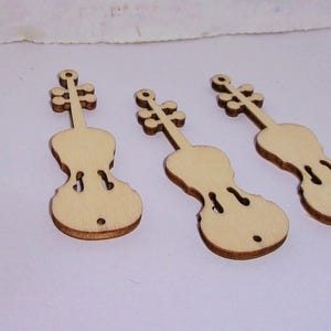May include: Five unfinished wooden violin cutouts. The cutouts are approximately 4 inches long and 1.5 inches wide. The cutouts are perfect for crafting and decorating.
