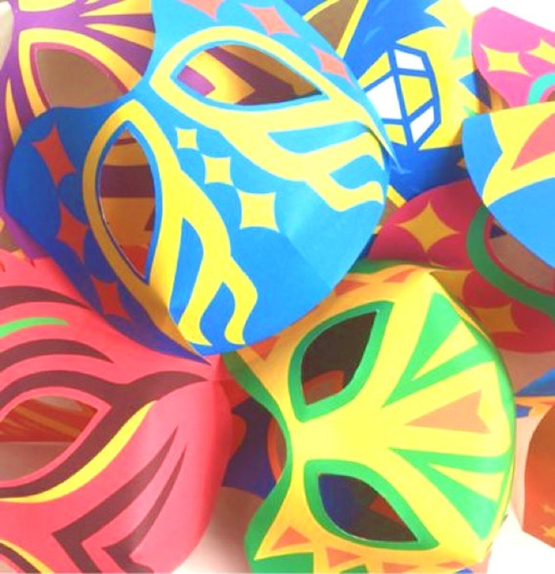 May include: A set of colorful paper masks with different designs. The masks are made of paper and have eye holes cut out. The masks are decorated with bright colors and patterns.