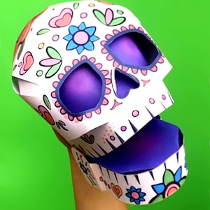 Plantilla e instrucciones para hacer una marioneta de mano con forma de calavera para imprimir y hacer tú mismo. Marioneta de papel con forma de calavera de azúcar casera. Descarga y crea archivos PDF