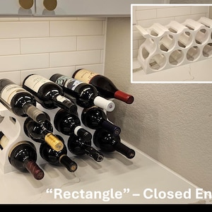 May include: White wine rack with closed ends, holding multiple bottles of wine. The rack is labeled "Rectangle" - Closed Ends.