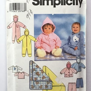 May include: Simplicity sewing pattern number 7807 for making baby clothes. The pattern includes instructions for making a hooded jumpsuit, a hooded jacket, a pair of pants, a shirt, and a blanket. The pattern is for sizes newborn, small, medium, and large.