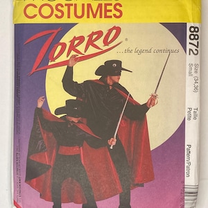 May include: A McCall's Costumes pattern envelope featuring a Zorro costume design. The image shows a figure in a black cape and mask, holding a sword. The envelope is yellow with red and blue text, and includes the size "Small (34,36)".