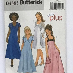 May include: A sewing pattern for girls' dresses in sizes 7-8, 10-12, and 14. The pattern includes four different styles: a blue dress with short sleeves, a light blue dress with short sleeves, a white dress with short sleeves and a matching cardigan, and a pink dress with a long skirt and a matching purse. The pattern is titled "Girls' Plus Sizes" and is from Butterick.
