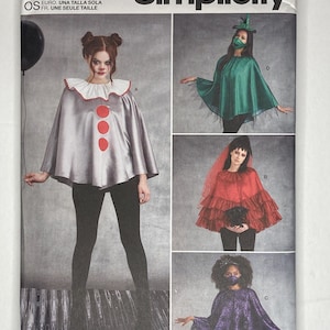 May include: Simplicity sewing pattern S9350 featuring costume designs. The pattern includes options for a clown cape with red accents, a green witch cape, a red ruffled cape, and a purple lace cape. The pattern is one size and designed and printed in the USA.