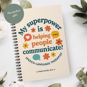 May include: Spiral-bound notebook with the text "My superpower is helping people communicate!" in teal, orange, and yellow. The notebook also includes the text "Speech-Language Therapist" and "Katie Smith, SLP". A green circle says "The perfect gift!"