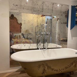 Distressed/antiqued mirror tiles, a metallic effect