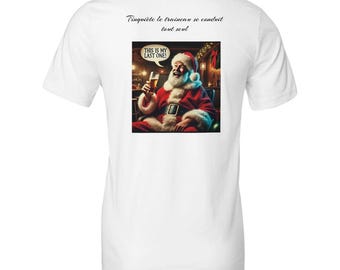Puede incluir: Camiseta blanca con un gráfico de Papá Noel sosteniendo una cerveza, con el texto "THIS IS MY LAST ONE!" en un bocadillo. Encima del gráfico está el texto "T'inquiète le traineau se conduit tout seul."