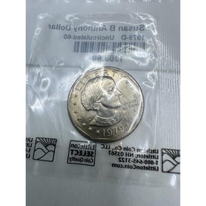 Dollaro Susan B Anthony del 1979 D. Errore, punto D riempito, errore FG e punto E Pluribus.
