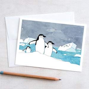 Carte de Noël pingouins à jugulaire : papeterie fantaisiste pour les fêtes d&#39;hiver