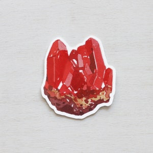 May include: A red crystal cluster sticker with a watercolor effect. The sticker is on a white background.