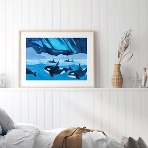 May include: A watercolor painting of a pod of orcas swimming under a blue and green aurora borealis. The orcas are black and white and are swimming in a blue ocean. The aurora borealis is a vibrant blue and green.