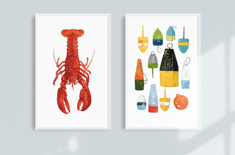 May include: Two framed prints, one with a red lobster and the other with a collection of colorful nautical buoys with numbers on them.