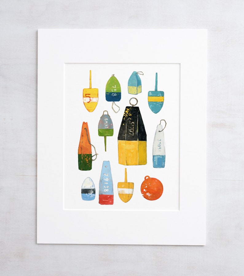 May include: A collection of 13 colorful, wooden, nautical buoys with various numbers painted on them. The buoys are arranged in a random pattern on a white background.