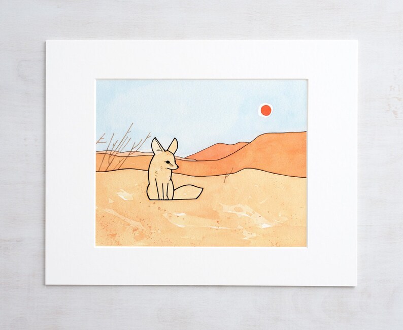 May include: A watercolour painting of a fennec fox sitting in a desert landscape. The fox is light brown with large ears and a white tail. The background is a sandy colour with a red sun in the sky.