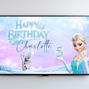 May include: A framed birthday banner featuring Elsa from Frozen. The banner has a light blue and purple background with snowflakes and the text "Happy Birthday Charlotte" and the number "5". Olaf the snowman is also featured.