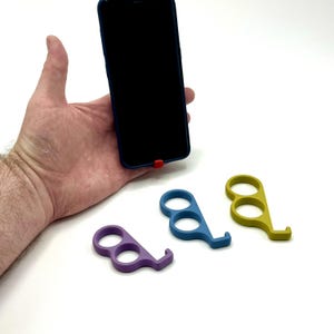 6Fingered Phone holder for your hand, give your hand an extra finger.