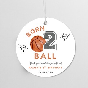 May include: A round white gift tag with a metal eyelet and string. It features an orange basketball, a large grey number 2, and the text BORN 2 BALL, Thank you for celebrating with me!, KADEN'S 2ND BIRTHDAY, and 10.15.20XX, with black play diagrams.