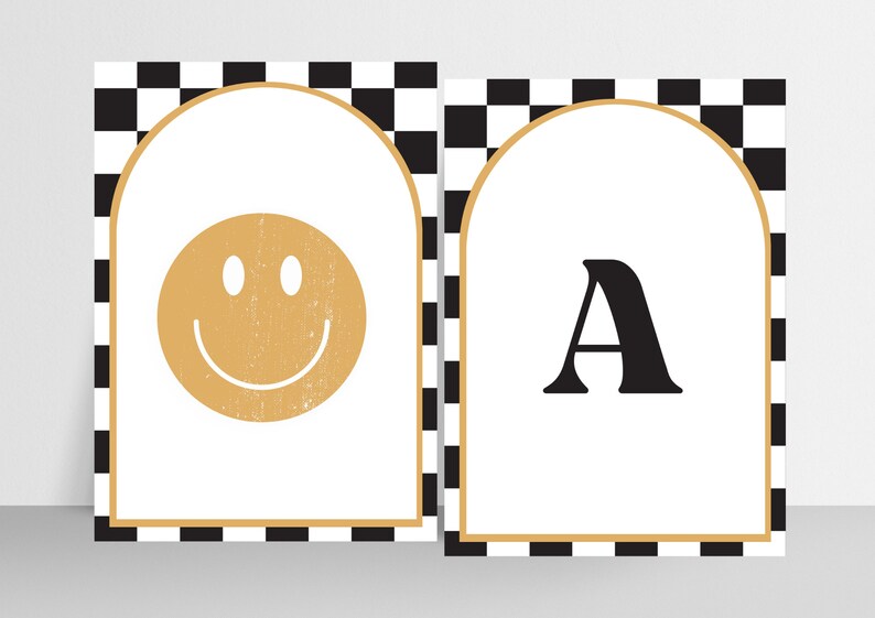 May include: Two printable wall art designs with a black and white checkered background. The first design features a gold smiley face in an arched frame. The second design features the letter "A" in black in an arched frame.