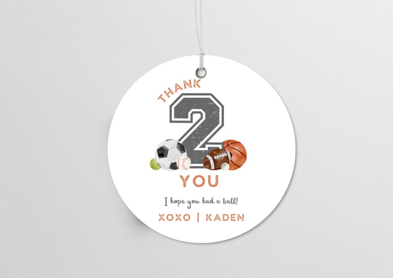 May include: Round white thank you tag with a gray number 2, a soccer ball, a baseball, a football, and a basketball. The text reads "Thank You, I hope you had a ball! XOXO | KADEN".