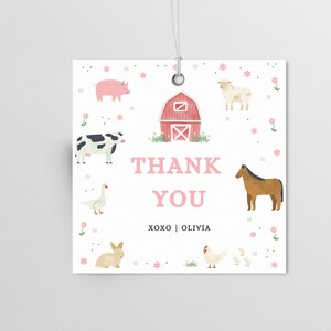 May include: A white thank you tag with a pink barn, a pig, a cow, a sheep, a horse, a goose, a rabbit, a chicken, and chicks. The text on the tag reads "Thank You XOXO | Olivia".
