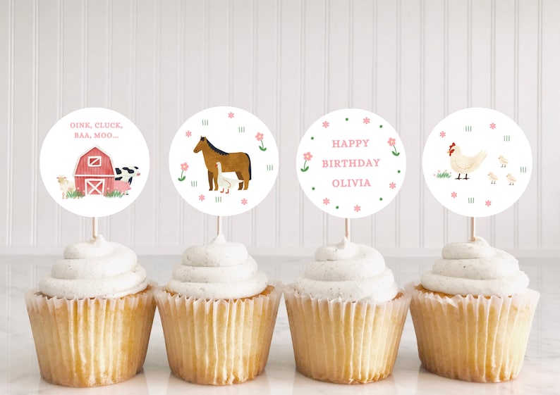 May include: Four cupcakes with farm animal themed cupcake toppers. The toppers are round and feature a horse, a barn with a cow, pig, and sheep, a chicken, and the text "OINK, CLUCK, BAA, MOO..." and "HAPPY BIRTHDAY OLIVIA".